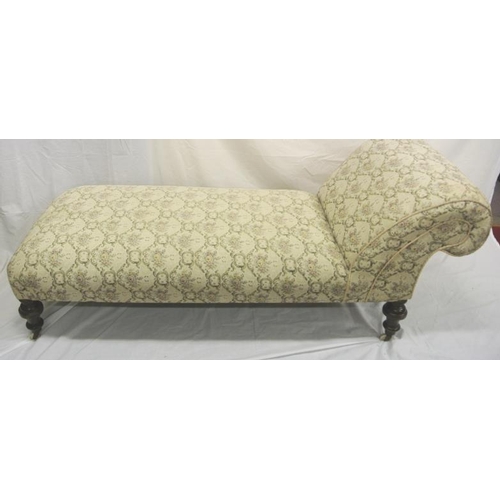 232 - Victorian mahogany chaise longue or daybed with foliate upholstery, on turned legs with casters