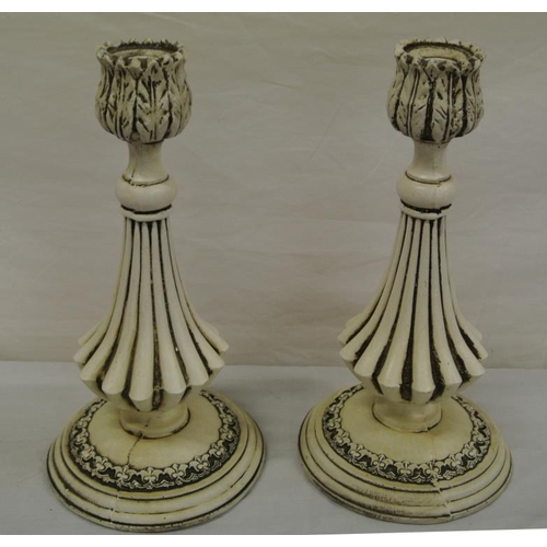 38 - Pair of carved candlesticks with foliate decoration
