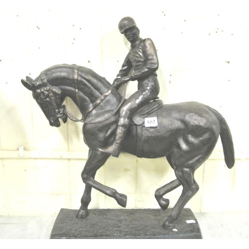 78 - Ornate bronzed figure of a horse and jockey, on oblong plinth