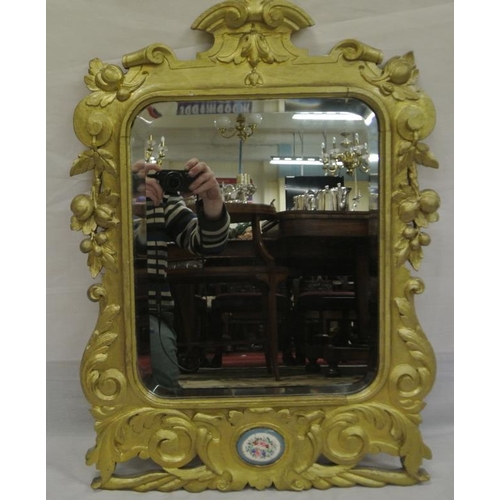 138 - French style beveled glass wall mirror in ornate floral and scroll decorated frame with oval Sevres ... 