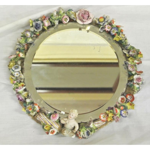 144 - Circular Dresden style beveled glass small mirror with ornate cherub and foliate encrustation