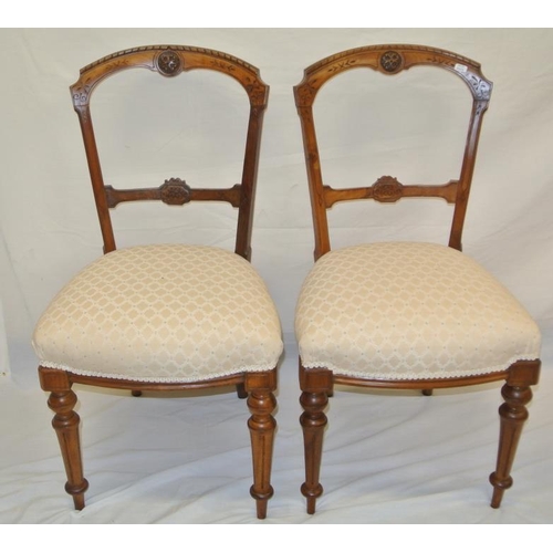 228 - Pair of Victorian walnut occasional chairs with upholstered seats on reeded tapering legs