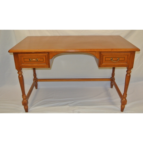 21 - Inlaid pine desk with two frieze drawers, brass drop handles, turned tapering legs with stretchers.