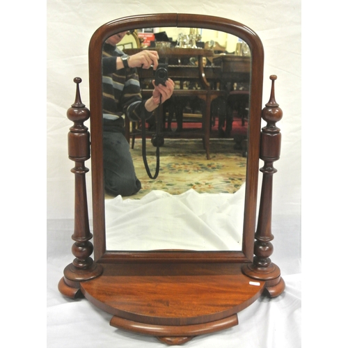 22 - Victorian style mahogany swivel mirror with turned columns, on bow fronted plinth with circular feet... 