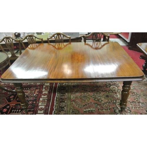 35 - Victorian mahogany extending dining table with extra leaf inset, rounded borders, on baluster turned... 