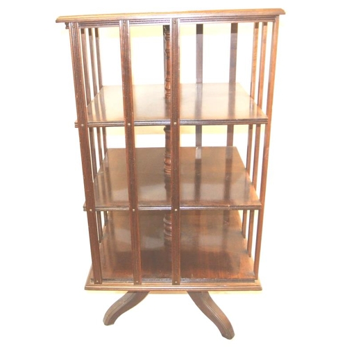 125 - Georgian mahogany 4-tier revolving bookcase with reeded rails and borders, on quadrapod