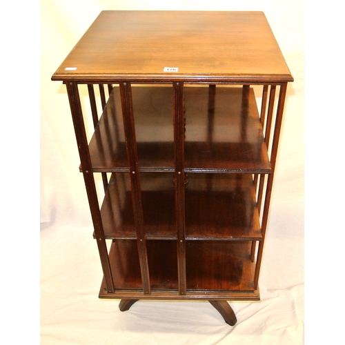 125 - Georgian mahogany 4-tier revolving bookcase with reeded rails and borders, on quadrapod