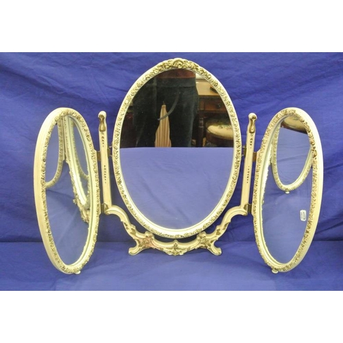 126 - French style oval triple dressing mirror with ornate foliate decoration