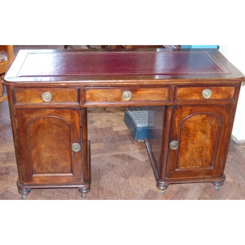 45 - Edwardian mahogany pedestal desk with leatherette inset, three frieze drawers, shelved presses under... 