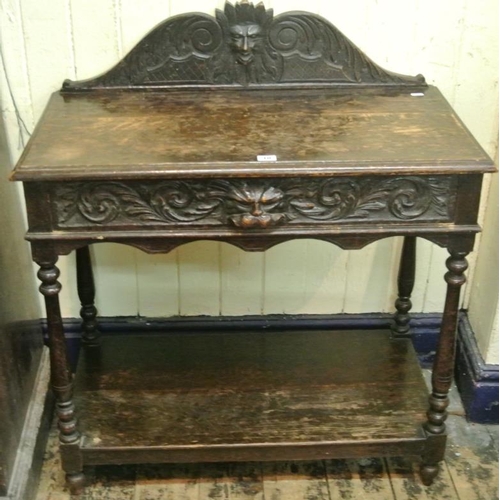 10 - Victorian oak hall or side table with scroll decorated back, frieze drawer, turned columns, on circu... 