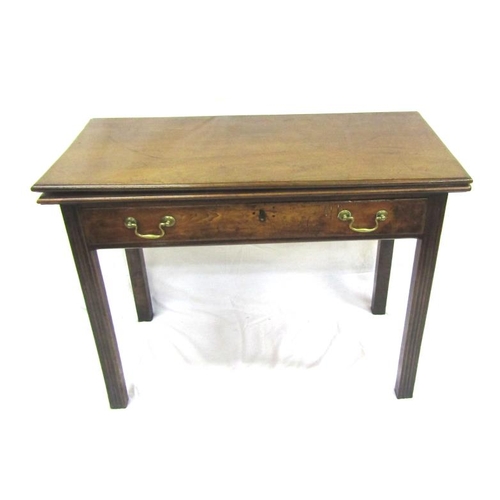 57 - Georgian mahogany tea table with fold-over top. gateleg support, frieze drawer with brass drop handl... 