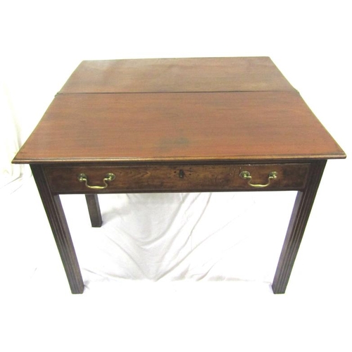 57 - Georgian mahogany tea table with fold-over top. gateleg support, frieze drawer with brass drop handl... 