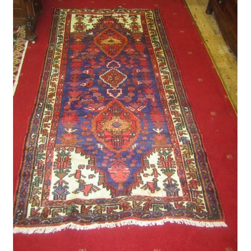 79 - Blue ground Persian village rug with unique medallion design. 200X100 (6.5