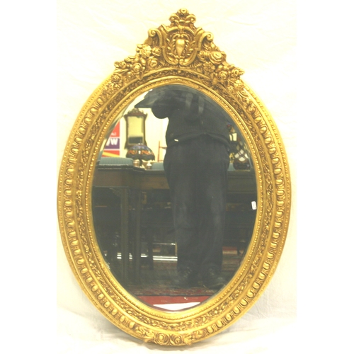 92 - Regency style oval glass bevelled wall mirror in ornate egg and dart and foliate decorated frame
120... 