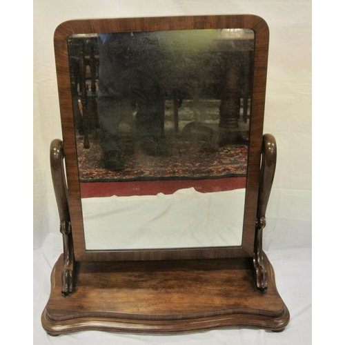 69 - Victorian mahogany swivel mirror with shaped columns, on serpentine fronted base