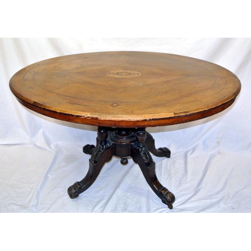 60 - Oval Edwardian inlaid mahogany centre table with tip-up top, on quadruple columns, on squardapod