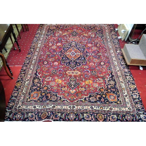 27 - Red ground Persian Mashad carpet with traditional design, 320 x 217cm