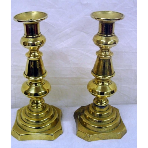 33 - Pair of Edwardian style brass candlesticks on stepped bases