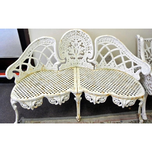 346 - Ornate cast iron garden seat with shaped domed back with serpentine fronted seat, on shaped legs