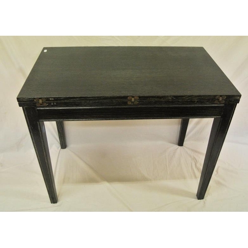 30 - American ebonised extending dining table with three leaves inset, on square tapering legs