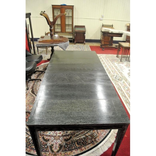 30 - American ebonised extending dining table with three leaves inset, on square tapering legs