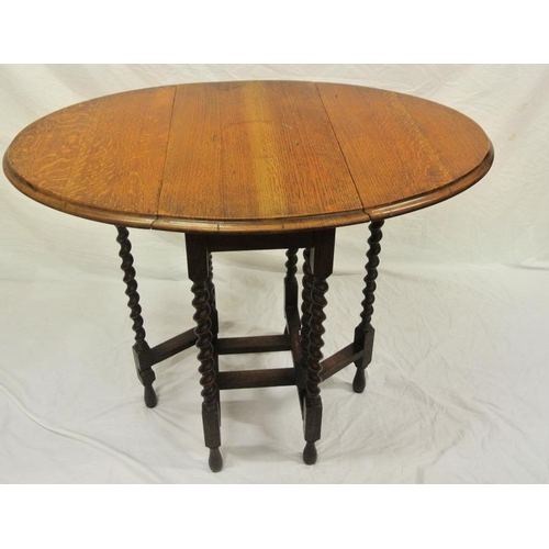39 - Victorian oak pembroke table with D-shaped drop leaves, pull-out supports, barleytwist columns, with... 