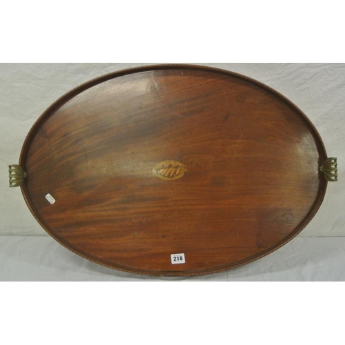 28 - Edwardian inlaid mahogany oval serving tray with shell inset, ornate foliate decorated brass handles