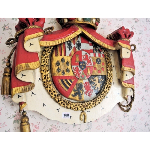 108 - Carved timber heraldic plaque with crown surmount, curtained sides and central heraldic plaque