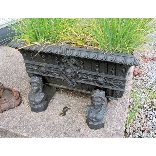 123 - Pair of oblong garden planters with foliate and figured decoration, on figured plinths