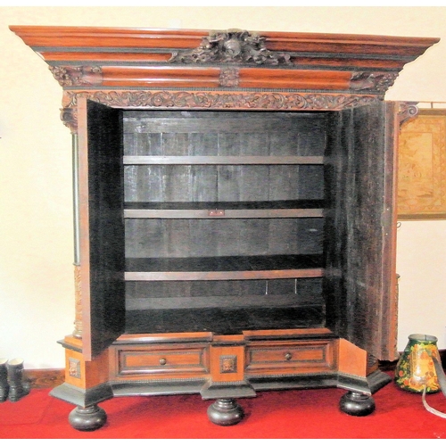 150 - Large French cabinet with foliate and cherub carved decoration, and columns, shelved interior, two d... 