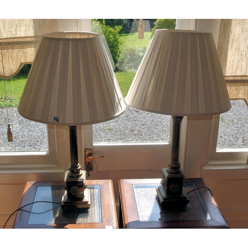 252 - Pair of ornate electric table lamps with Corinthian columns, lionmask mounts, on stepped bases