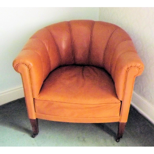 4 - Leather upholstered tub chair with square legs on castors