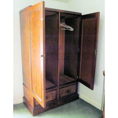 8 - Walnut double wardrobe with panelled doors, handles, fitted for hanging, two drawers under, on plint... 