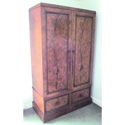 8 - Walnut double wardrobe with panelled doors, handles, fitted for hanging, two drawers under, on plint... 