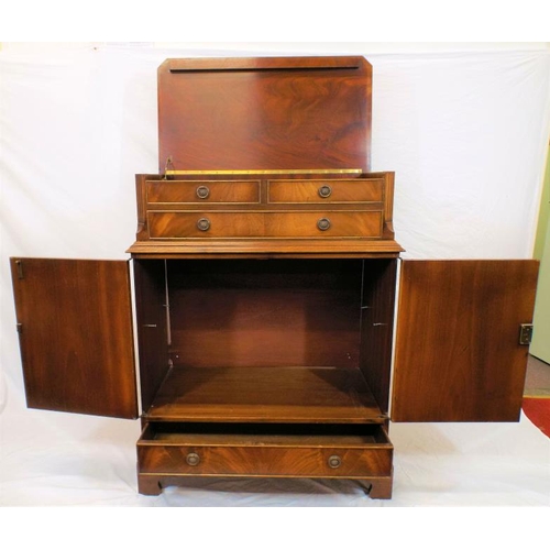 25 - Edwardian mahogany cabinet with drop-down front, press under with panelled doors, drawer under with ... 