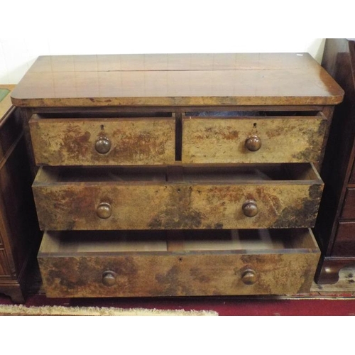 75 - Victorian walnut chest of two short and two long drawers with bun handles and brass escutcheons.
Top... 