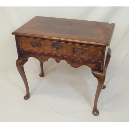 90 - Georgian inlaid walnut lowboy with frieze drawer, brass drop handle and escutcheon, shaped apron, on... 