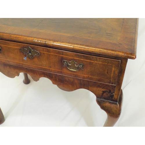 90 - Georgian inlaid walnut lowboy with frieze drawer, brass drop handle and escutcheon, shaped apron, on... 