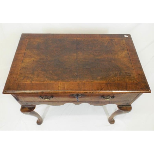 90 - Georgian inlaid walnut lowboy with frieze drawer, brass drop handle and escutcheon, shaped apron, on... 