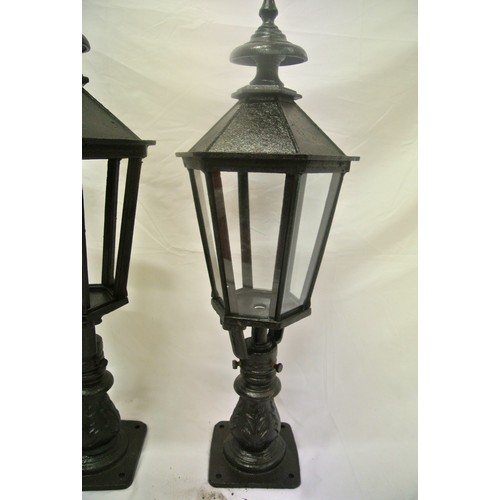 202 - Pair of cast iron outdoor lamps of hexgonal tapering form with glass insets (Not Fitted)