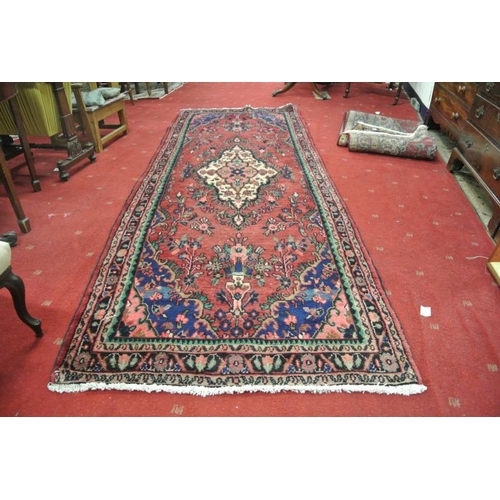 239 - Washed red ground full pile Sarouk runner 319 x 116cm