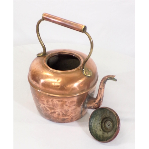 107 - Victorian copper kettle with shaped handle and spout