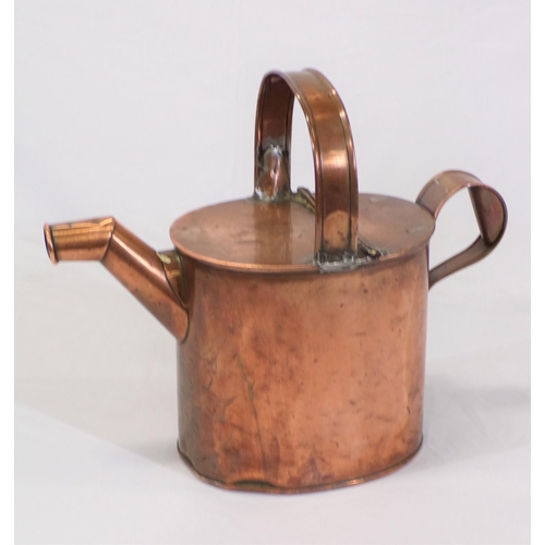 108 - Victorian copper watering jug with shaped handles