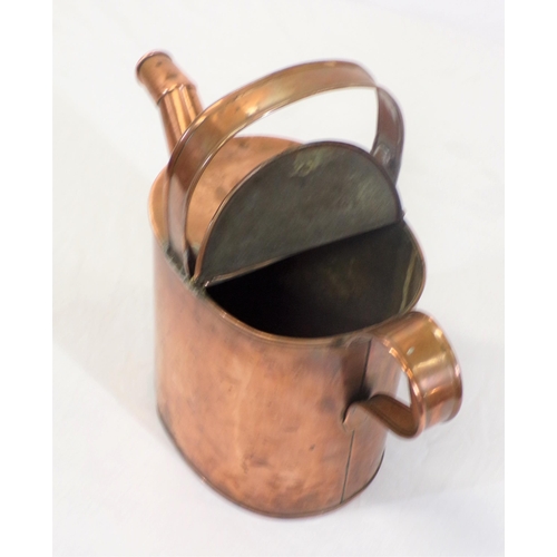 108 - Victorian copper watering jug with shaped handles