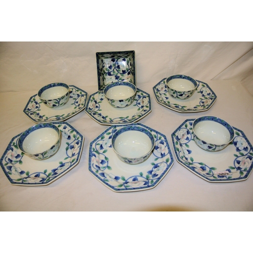 122 - Thirteen piece Japanese floral decorated service