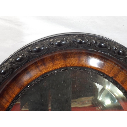 139 - Victorian style oval bevelled glass wall mirror in ornate rosewood frame