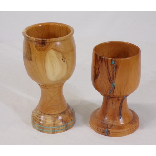 143 - Pair of turned yew goblets with round bases