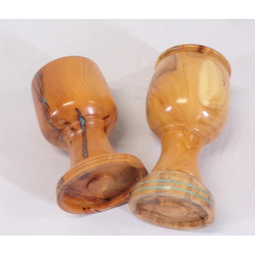 143 - Pair of turned yew goblets with round bases