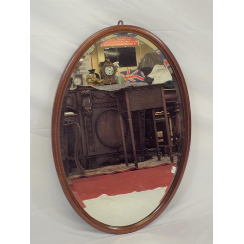 148 - Edwardian inlaid mahogany framed oval wall mirror