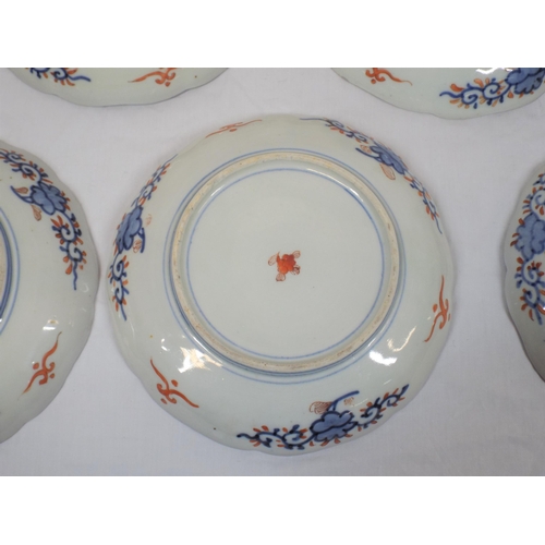 167 - Set of seven Imari plates with wavy rims, burnt ochre and deep blue and yellow foliate decoration